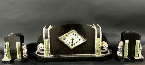 An Art Deco polished slate and marble mantle clock garniture, the clock measuring 23 cm high, 44cm