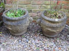 A pair of weathered garden planters