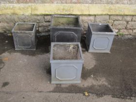 Four faux lead Georgian style square planters, the largest example 38cm square