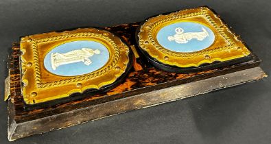 A Victorian coromandel self closing book slide, with applied brass fitting with Wedgwood Jasper ware