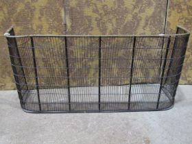 19th century brass and wire fender with curved brass rail, 16cm wide x 46cm high (af)