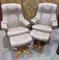 A pair of Stressless style swivel adjustable lounge chairs with cream coloured soft leather