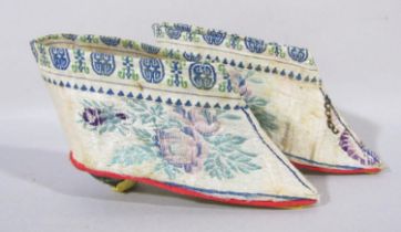 A pair of Chinese silk embroidered children’s shoes, 10cm long