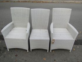 A pair of good quality rattan garden/conservatory armchairs together with a matching single chair