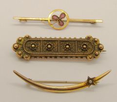 Three antique gold brooches; a Late Victorian 15ct example with beaded detail, 3.1g, a 10k