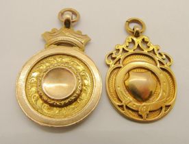 Two 1920s 9ct medal fobs; maker 'J.W.T', Birmingham 1921 and maker 'T.F', Birmingham 1924, 19.7g