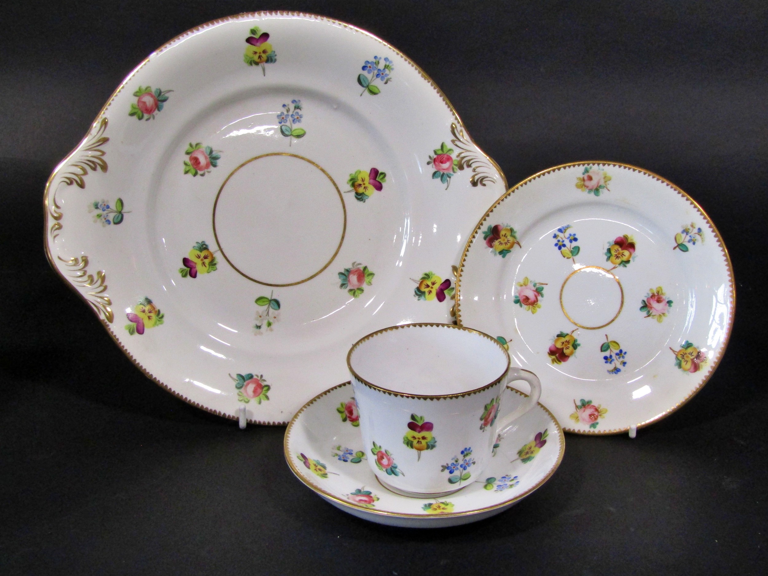 19th century floral tea set with hand painted decoration showing roses, pansies, forget-