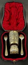 Late Victorian silver Christening set comprising beaker, fork, spoon and napkin ring bearing