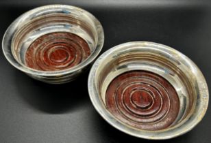 A pair of silver wine coasters, Birmingham 1971, maker PH Vogel & Co, 12.5cm wide