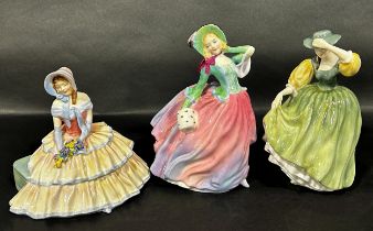 Three Doulton figures of ladies, Autumn Breezes, Buttercup and Daydream