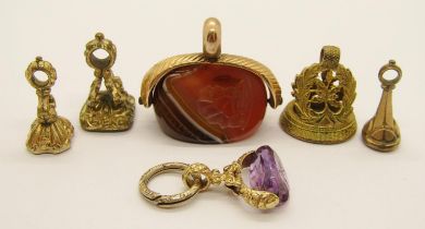 Group of six antique intaglio-cut seal fobs comprising a yellow metal banded agate swivel example