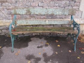 Victorian bench with weathered timber slats (af) raised on decorative vine leaf cast iron end
