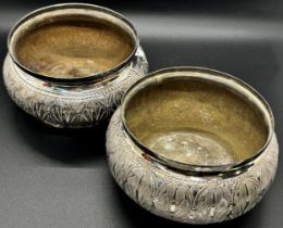 A pair of Indian silver metal bowls, with lotus leaf engraving, stamps to base, 13cm wide