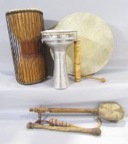 A collection of percussion instruments including a tambour drum.