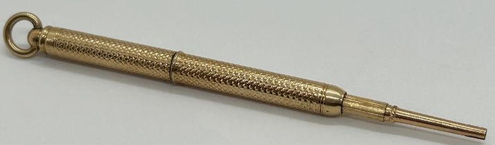 Yellow metal unmarked propelling pencil with inscription