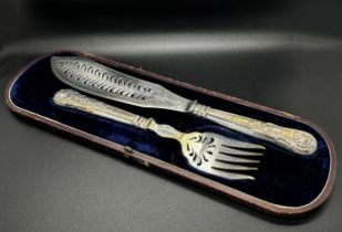 A pair of Victorian silver fish serving knives and forks, Sheffield 1862, maker Joseph Rogers &