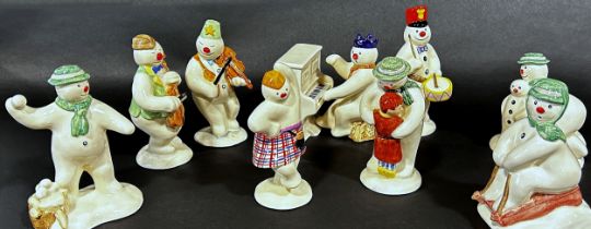 A 12 piece Royal Doulton 'Snowman' figures, band, drummer, snow balling, etc