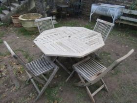 Weathered Firman Leisure teak folding garden table with segmented slatted octagonal top, 120cm