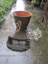 Small 19th century cast iron boot scraper with tray base, together with a weathered terracotta