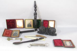 A collection of five early family portrait photographs in leather cases, a brass pastry wheel, a set