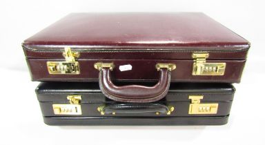 Two soft leather Italian combination lock attaché cases, one black, one brown.