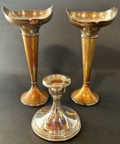 A pair of early 20th century silver posy vases with a flared floral rim, Birmingham 1919, maker