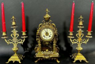 A continental gilt brass mantle clock garniture, the clock 39cm high.