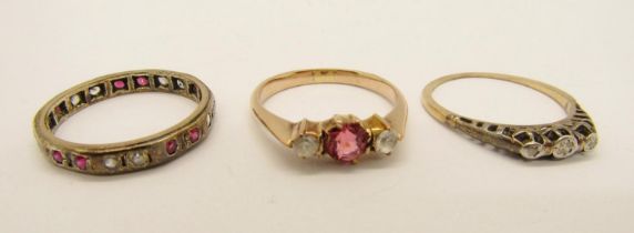 Group of three dress rings; a yellow metal three stone diamond ring (worn), a yellow metal paste set