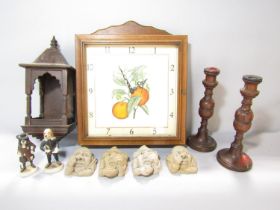 A wall clock with an old coloured botanical print of oranges set in a wooden glazed frame with