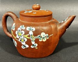 Late 19th century Chinese terracotta teapot with applied enamelled detail, and a further Japanese