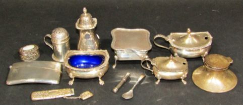 A mixed selection of silverware including five assorted condiments, a card case, a squat inkwell,