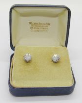 Exceptional pair of white metal diamond stud earrings in eight claw setting, the diamonds