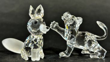 Two miniature Swarovski Crystal figures, a fox and lion cub.