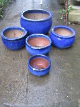 Five contemporary blue glazed squat oviform garden planters, the largest 40cm diameter x 26cm high