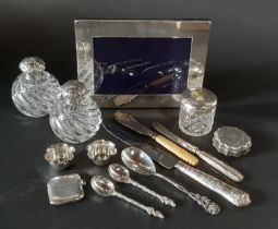 A late 20th century silver photo frame with flat sides and oversized hallmarks, a glass dressing