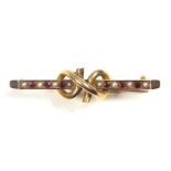 Edwardian 15ct gold bar brooch set red spinel and seed pearls, with a double loop mount, L.4.4cm,