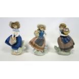 3 Lladro figures of girls holding baskets of flowers, tallest H.17.5cm, 2 boxed; bisque porcelain