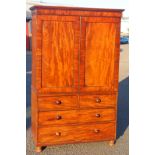 George IV mahogany linen press with a moulded cornice and 2 panelled doors above enclosing 5