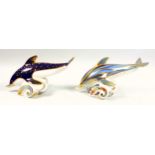 Royal Crown Derby dolphin, W.16cm; and another dolphin, one with silver button. (2)