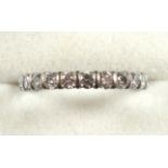 White metal eternity ring set 23 diamonds, gross 3.4grs