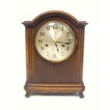Early 20th century American mantel clock with a silvered circular dial and Arabic numerals,