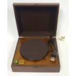 Columbia record player in a walnut case with hinged cover and painted logo, bakelite pick up, 2 tins