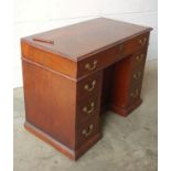 George III inlaid mahogany kneehole desk with a long drawer and 6 drawers below flanking a panel