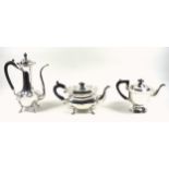 Edwardian silver teapot of moulded rounded rectangular form, with a shaped rim and hinged cover,