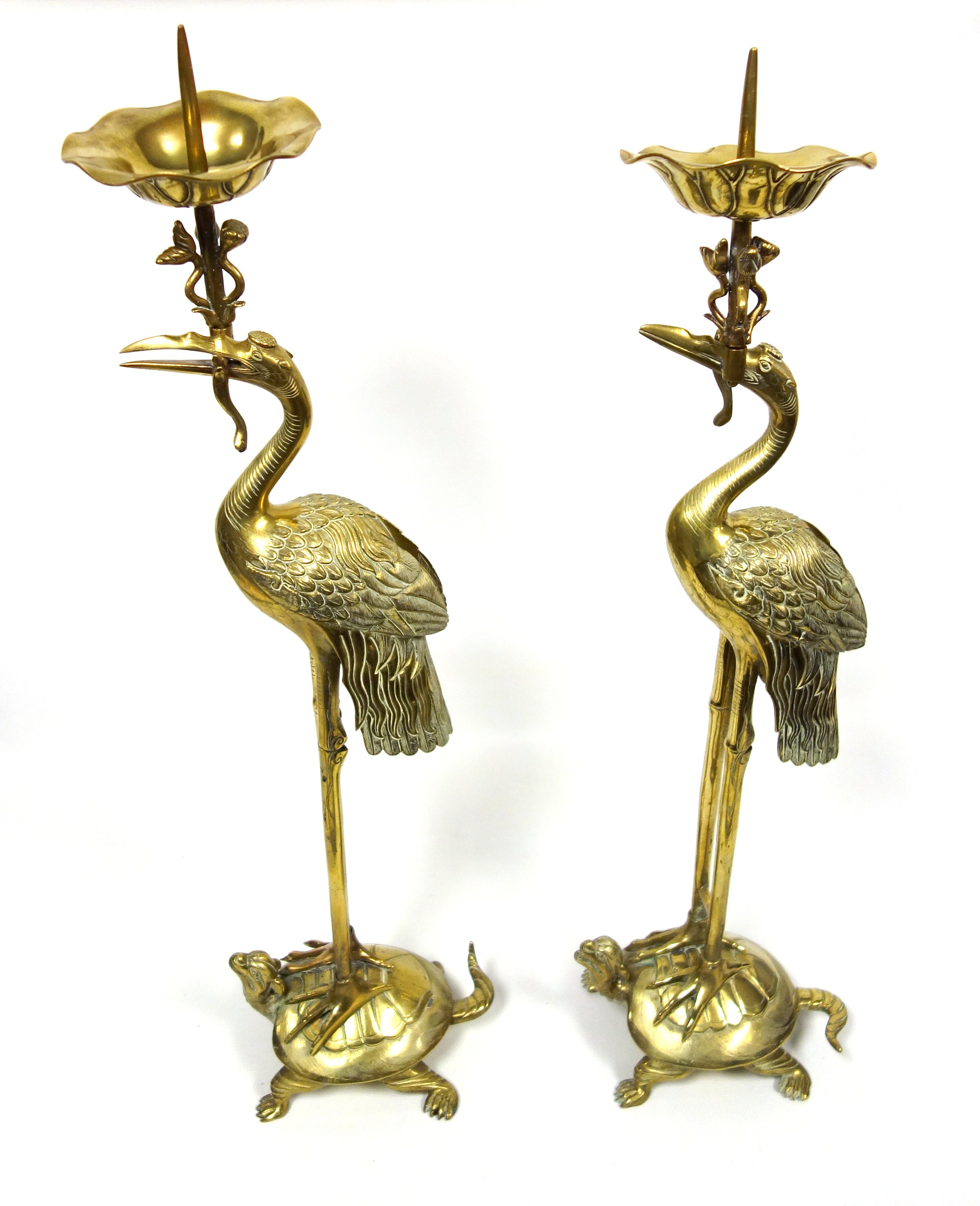 Pair of tall Japanese cranes, each supporting a pricket candle holder and standing on a tortoise,