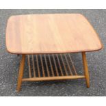 Ercol coffee table with a rounded square light elm top, birch spindle undertier and tapering legs,