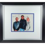 Signed photograph of 3 band members of The Who, depicting Pete Townshend, Roger Daltrey and John