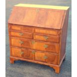 George I walnut bureau with inlaid herringbone banding, oyster veneered top, fall front disclosing 7