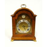 George III style mantel clock with a brass dial enclosing an Elliott 8 day movement striking on a