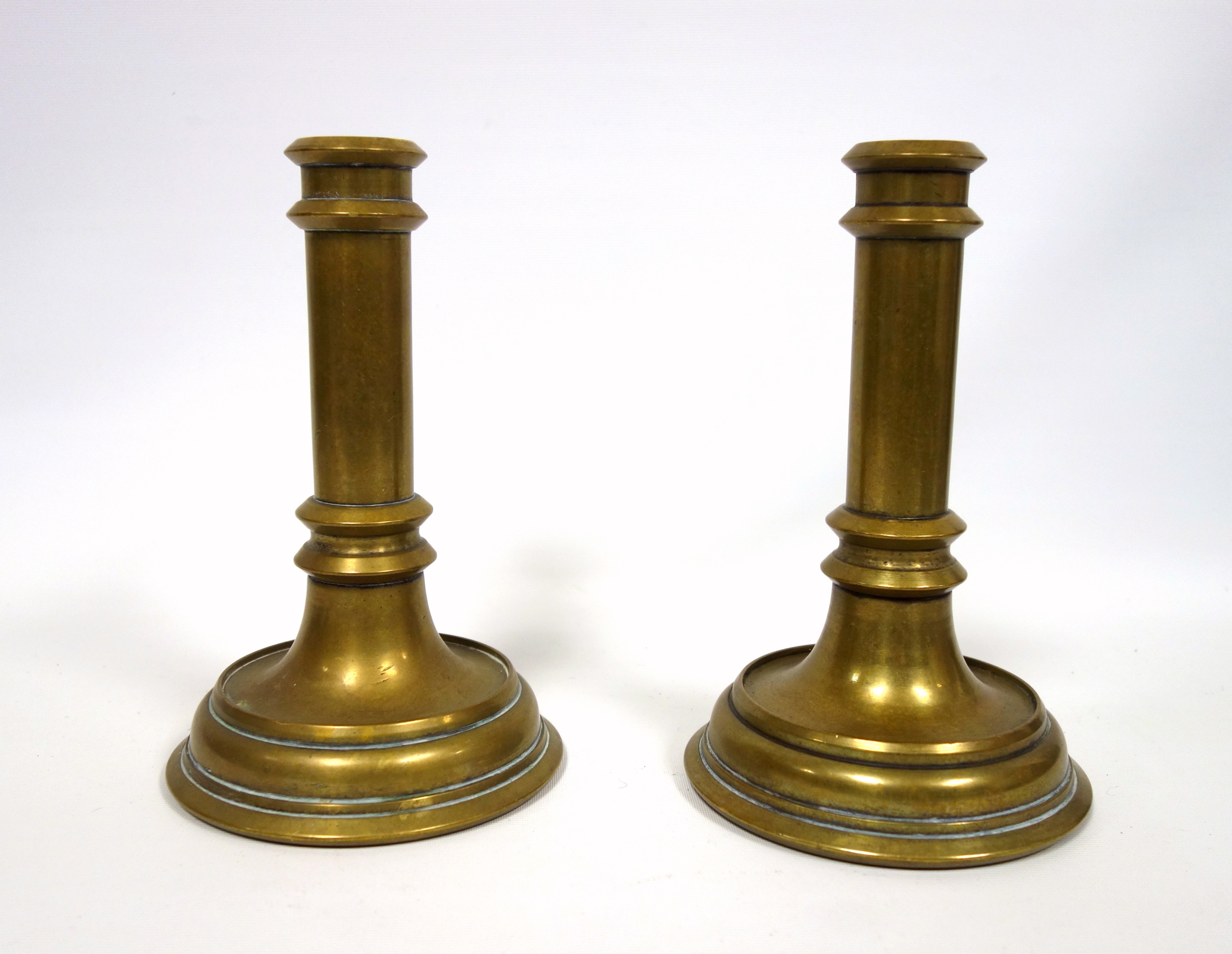 Pair of Victorian heavy brass candlesticks, unengraved and lacking nozzles, H.19.8cm. (2)